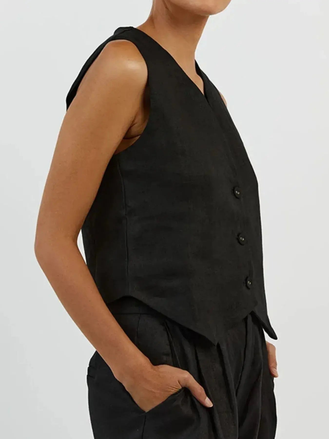 Functional pockets enhance convenience while lending the outfit a utilitarian charm. The top features a modest crop that pairs effortlessly with high-waisted bottoms, while the straight-leg pants offer ease through the hips and thighs. Available in sizes XS to 3XL, the set includes detailed measurements—waist starting at 23.2", bust from 32.3", and full bottom length up to 41.3"—to ensure a personalized fit.