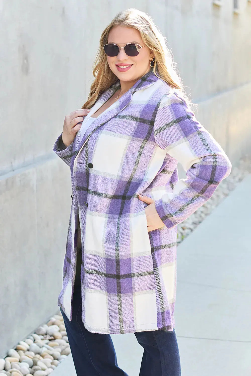 Wrap yourself in cozy charm with this Pink Plaid Button-Up Coat—a statement layer that blends warmth with playful sophistication. Designed in a soft checkered weave of blush, ivory, and brown, this midweight coat features a relaxed fit that’s perfect for layering over your everyday essentials. Classic button-front detailing and side pockets offer practicality, while the longline silhouette adds a modern, polished finish. Whether you're strolling downtown or escaping to a weekend cabin, this piece brings tex