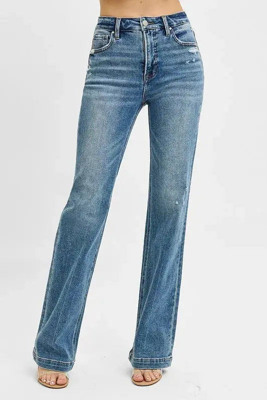 These classic blue flare leg jeans feature a high-waisted design that creates a flattering silhouette while offering a fashion retro-inspired look. Made from premium stretch denim fabric, they provide all-day comfort with a perfect fit through the hips and thighs before flaring out at the knee. The medium blue wash with subtle fading gives them a versatile appeal suitable for both casual and semi-dressy occasions.