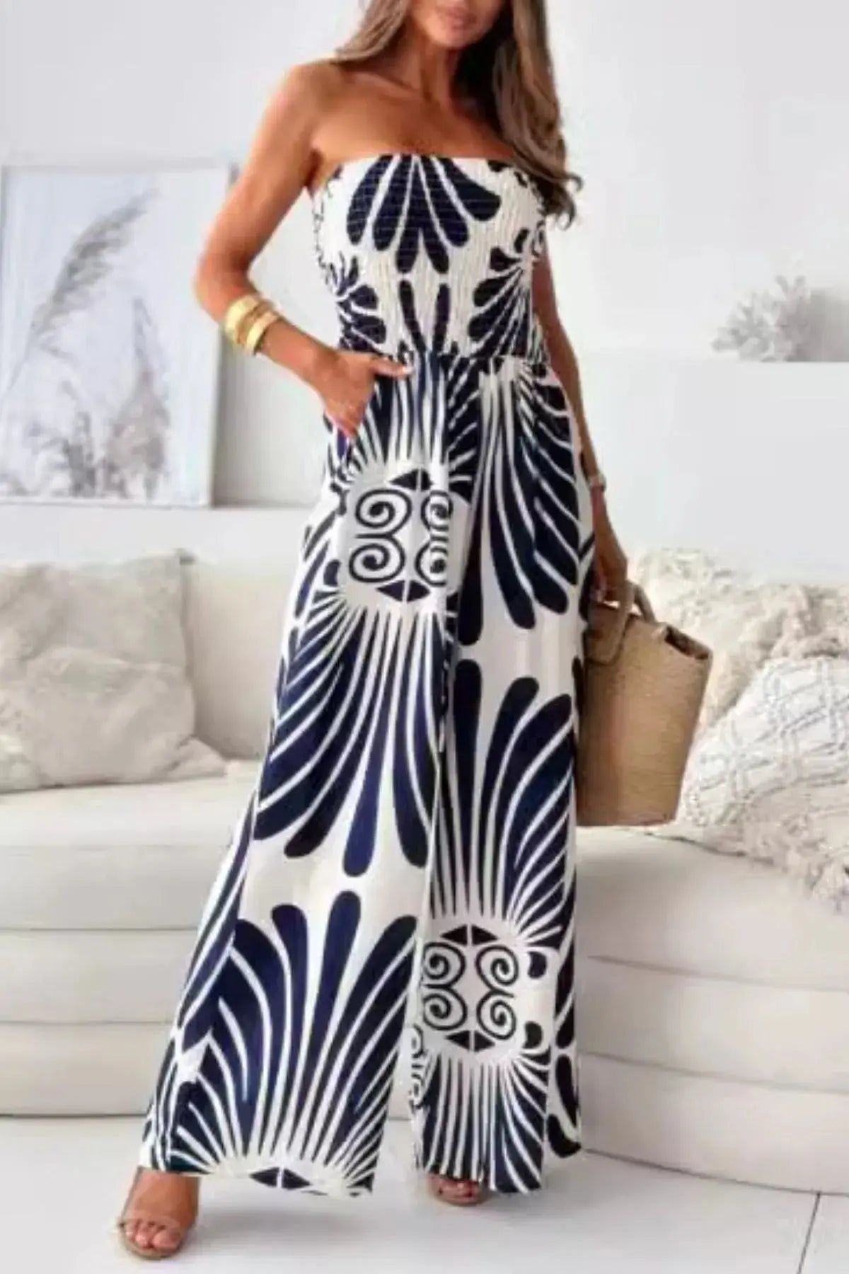 Crafted from 100% wrinkle-resistant polyester, this jumpsuit is machine washable and ready to roll. Functional pockets add practicality without compromising the clean lines of the design, while top lengths between 47.2" and 48.8" across sizes S to 2XL suit a variety of frames with ease. Bust measurements ranging from 34.6" to 43.3" ensure it hugs where it counts, without feeling restrictive.