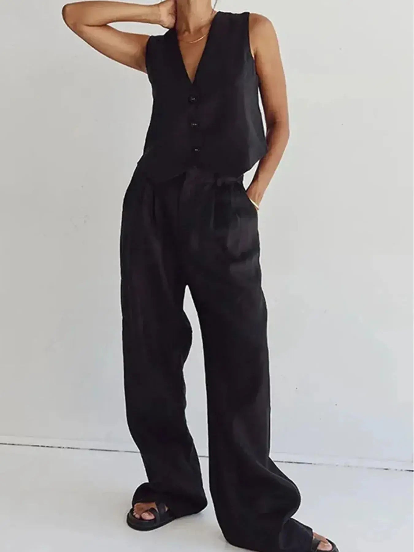 Functional pockets enhance convenience while lending the outfit a utilitarian charm. The top features a modest crop that pairs effortlessly with high-waisted bottoms, while the straight-leg pants offer ease through the hips and thighs. Available in sizes XS to 3XL, the set includes detailed measurements—waist starting at 23.2", bust from 32.3", and full bottom length up to 41.3"—to ensure a personalized fit.