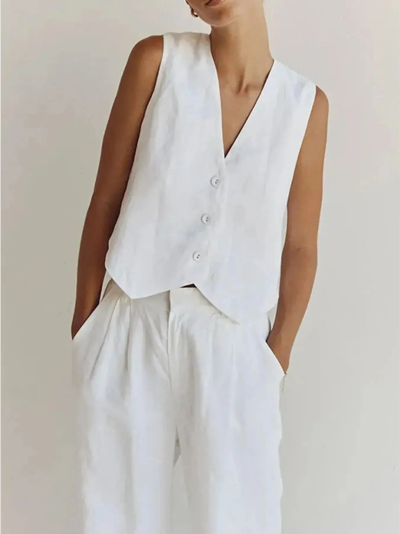 Functional pockets enhance convenience while lending the outfit a utilitarian charm. The top features a modest crop that pairs effortlessly with high-waisted bottoms, while the straight-leg pants offer ease through the hips and thighs. Available in sizes XS to 3XL, the set includes detailed measurements—waist starting at 23.2", bust from 32.3", and full bottom length up to 41.3"—to ensure a personalized fit.