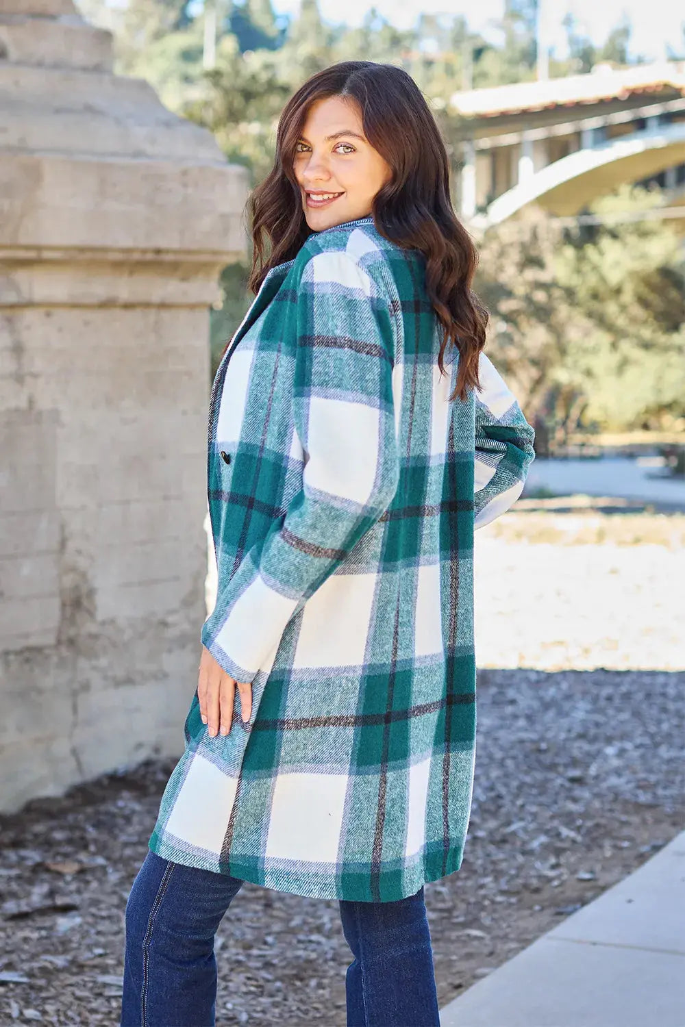 Wrap yourself in cozy charm with this Pink Plaid Button-Up Coat—a statement layer that blends warmth with playful sophistication. Designed in a soft checkered weave of blush, ivory, and brown, this midweight coat features a relaxed fit that’s perfect for layering over your everyday essentials. Classic button-front detailing and side pockets offer practicality, while the longline silhouette adds a modern, polished finish. Whether you're strolling downtown or escaping to a weekend cabin, this piece brings tex