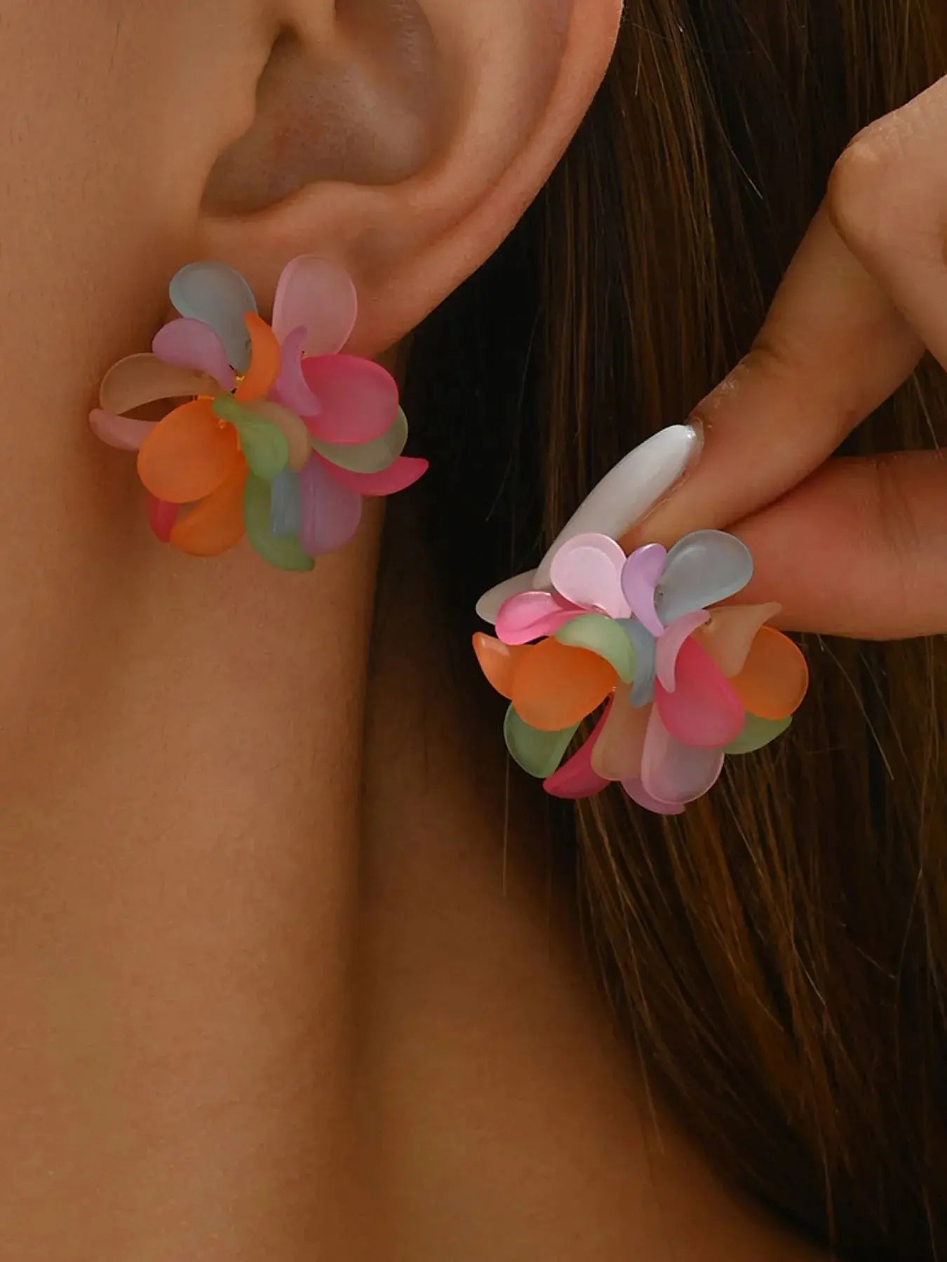 Lightweight and corrosion-resistant when properly cared for, they are imported for quality and comfort. The push-back closure provides a secure fit, ideal for all-day wear across seasons. Designed as a single-pair style, they're easy to match with denim jackets, resort sets, or minimalist tops for a flash of florals. Sweat should be avoided to preserve the finish—just a simple wipe keeps the glow going.