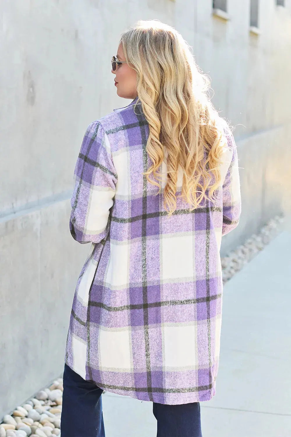 Wrap yourself in cozy charm with this Pink Plaid Button-Up Coat—a statement layer that blends warmth with playful sophistication. Designed in a soft checkered weave of blush, ivory, and brown, this midweight coat features a relaxed fit that’s perfect for layering over your everyday essentials. Classic button-front detailing and side pockets offer practicality, while the longline silhouette adds a modern, polished finish. Whether you're strolling downtown or escaping to a weekend cabin, this piece brings tex