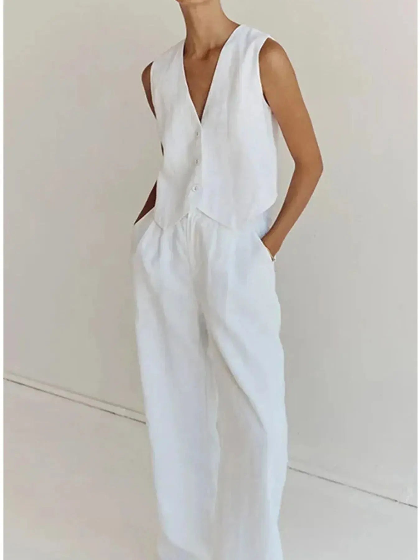 Functional pockets enhance convenience while lending the outfit a utilitarian charm. The top features a modest crop that pairs effortlessly with high-waisted bottoms, while the straight-leg pants offer ease through the hips and thighs. Available in sizes XS to 3XL, the set includes detailed measurements—waist starting at 23.2", bust from 32.3", and full bottom length up to 41.3"—to ensure a personalized fit.