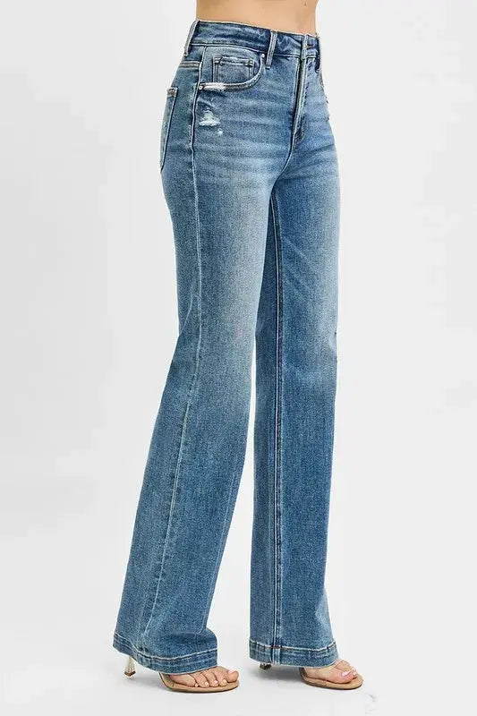These classic blue flare leg jeans feature a high-waisted design that creates a flattering silhouette while offering a fashion retro-inspired look. Made from premium stretch denim fabric, they provide all-day comfort with a perfect fit through the hips and thighs before flaring out at the knee. The medium blue wash with subtle fading gives them a versatile appeal suitable for both casual and semi-dressy occasions.