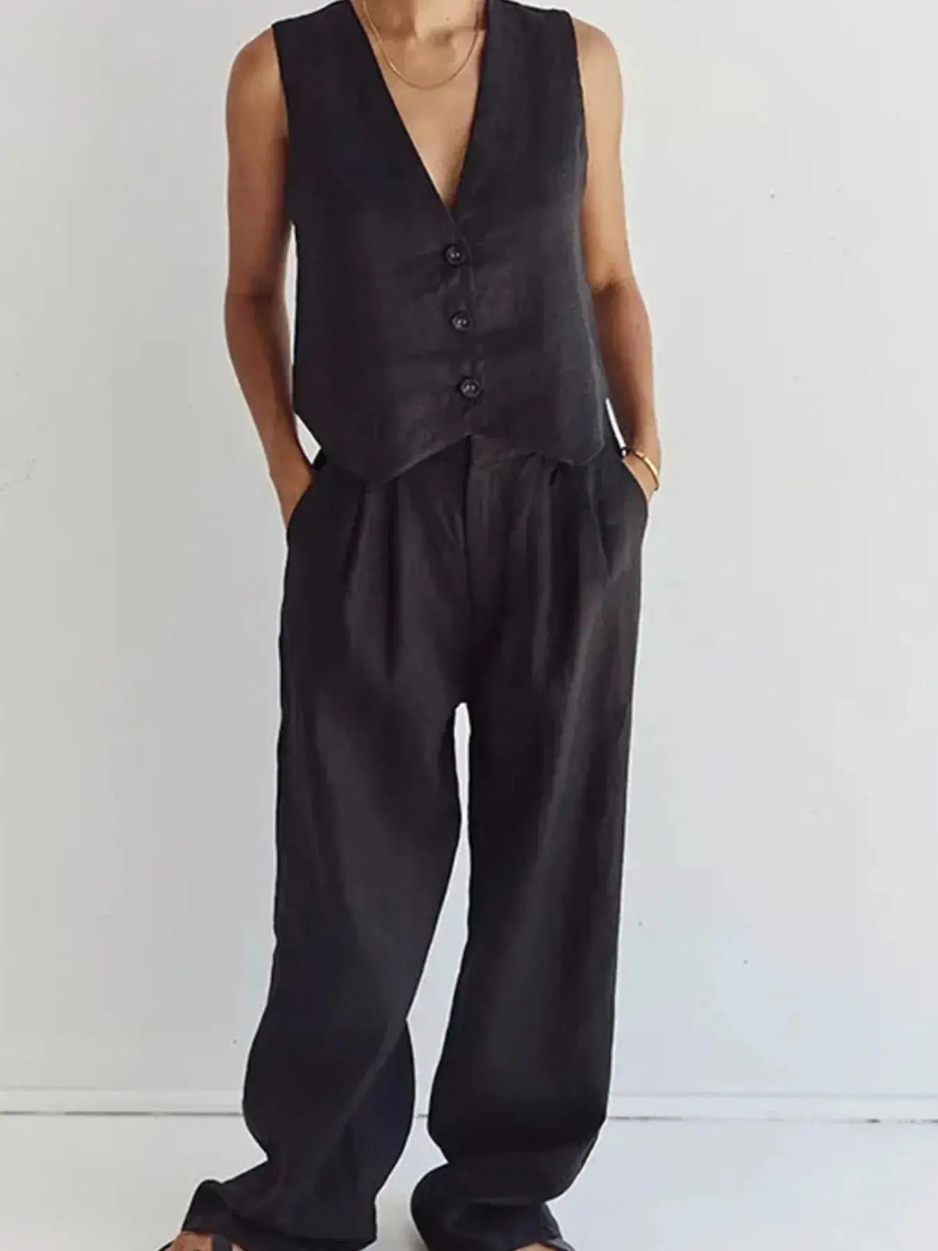 Functional pockets enhance convenience while lending the outfit a utilitarian charm. The top features a modest crop that pairs effortlessly with high-waisted bottoms, while the straight-leg pants offer ease through the hips and thighs. Available in sizes XS to 3XL, the set includes detailed measurements—waist starting at 23.2", bust from 32.3", and full bottom length up to 41.3"—to ensure a personalized fit.