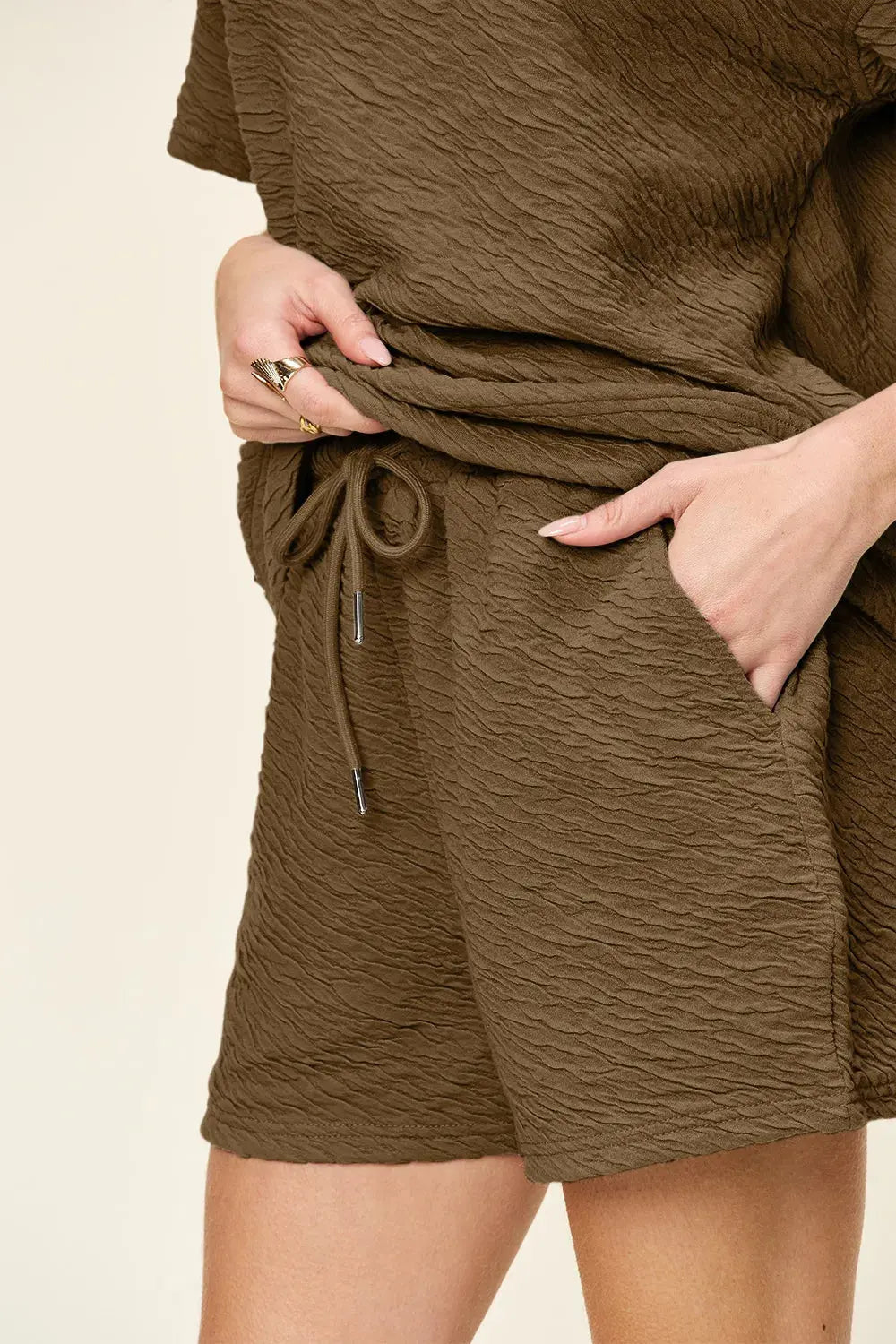 This full-size set from Double Take delivers effortless style with a tactile twist. The short sleeve T-shirt features a relaxed fit and subtle allover texture, offering a modern update to a classic silhouette. Its soft drape and breathable fabric make it ideal for warm-weather wear or layering on cooler days.