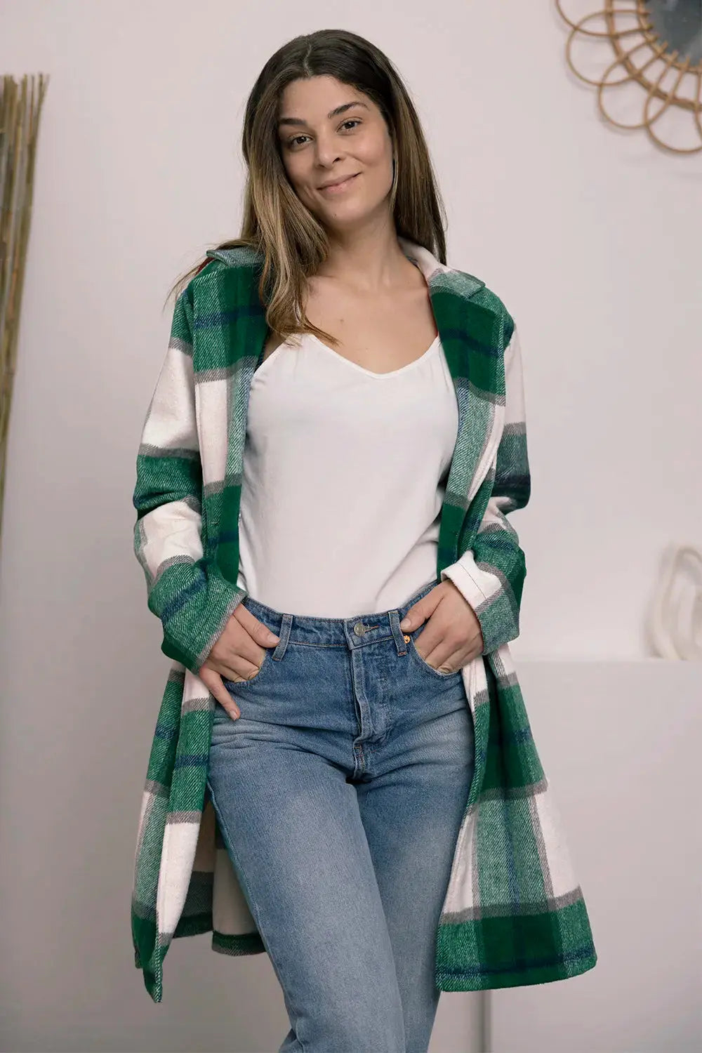 Wrap yourself in cozy charm with this Pink Plaid Button-Up Coat—a statement layer that blends warmth with playful sophistication. Designed in a soft checkered weave of blush, ivory, and brown, this midweight coat features a relaxed fit that’s perfect for layering over your everyday essentials. Classic button-front detailing and side pockets offer practicality, while the longline silhouette adds a modern, polished finish. Whether you're strolling downtown or escaping to a weekend cabin, this piece brings tex