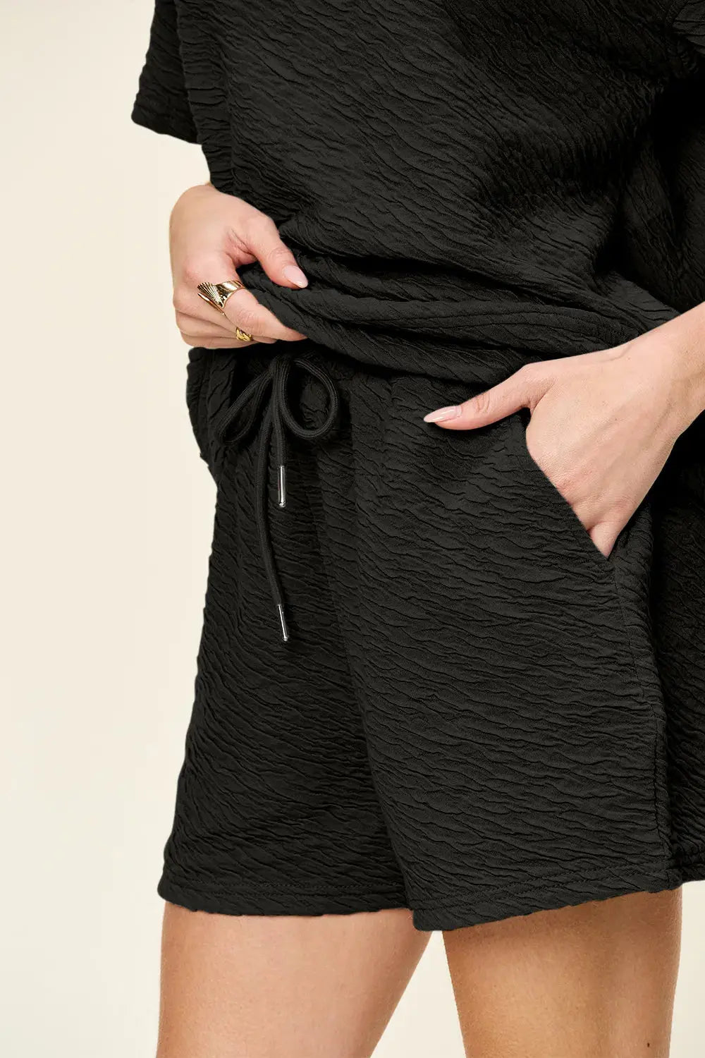 This full-size set from Double Take delivers effortless style with a tactile twist. The short sleeve T-shirt features a relaxed fit and subtle allover texture, offering a modern update to a classic silhouette. Its soft drape and breathable fabric make it ideal for warm-weather wear or layering on cooler days.