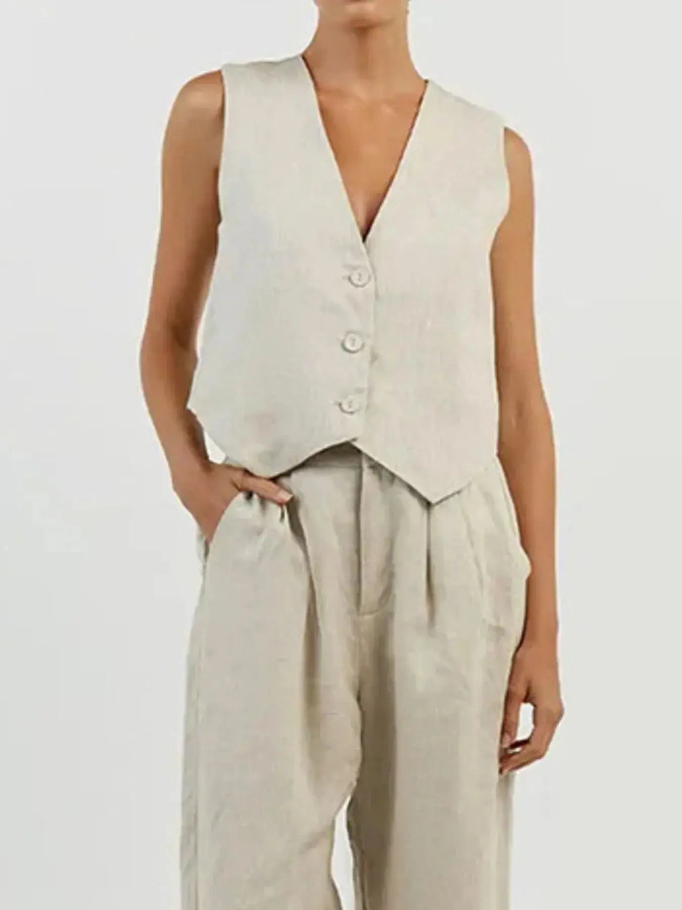 Functional pockets enhance convenience while lending the outfit a utilitarian charm. The top features a modest crop that pairs effortlessly with high-waisted bottoms, while the straight-leg pants offer ease through the hips and thighs. Available in sizes XS to 3XL, the set includes detailed measurements—waist starting at 23.2", bust from 32.3", and full bottom length up to 41.3"—to ensure a personalized fit.