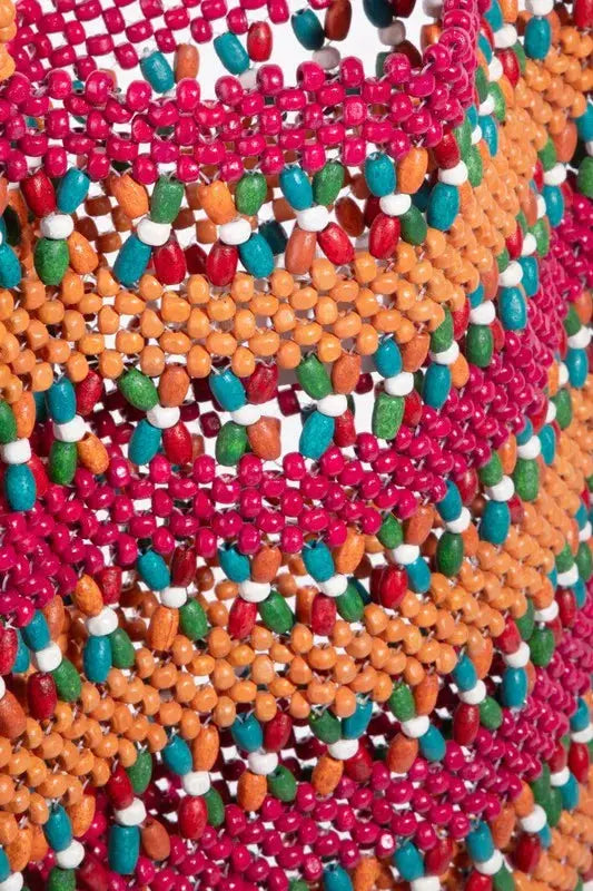 Close-up Picture of Eco Sustainable Handcrafted Bag made with bright wooden pieces. A colorful masterpiece.