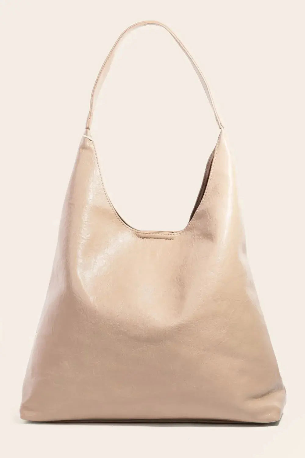 Beige handbag on a light beige background
