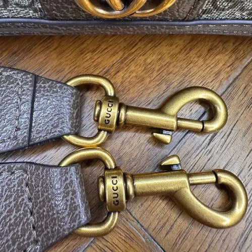 Elevate your accessory collection with this sophisticated designer-inspired crossbody bag. Featuring an elegant monogram print that exudes timeless style, this high-quality bag combines functionality with fashion-forward design. Perfect for everyday wear, it offers convenient hands-free carrying while making a refined statement.