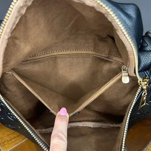 This classic designer-style crossbody bum bag combines timeless elegance with practical functionality. Crafted for those who appreciate refined fashion, it offers a sleek silhouette and adjustable strap for comfortable, hands-free wear. Ideal for carrying essentials securely while maintaining a sophisticated look, this bag is perfect for everyday use or stylish outings.