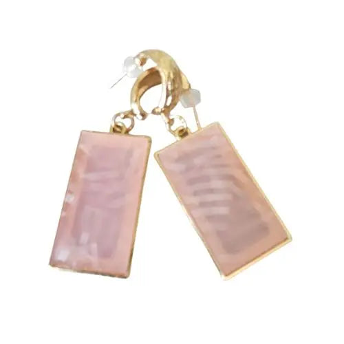 Bring warmth and understated elegance to your look with the Blush Radiance Earrings, crafted to highlight the harmony of soft femininity and bold structure. Each earring features a blush-toned gemstone delicately set within a rectangular gold frame, accented by brushed textures that add dimension and visual intrigue. The subtle sparkle evokes gentle confidence, perfect for elevating any style from casual sophistication to formal charm.