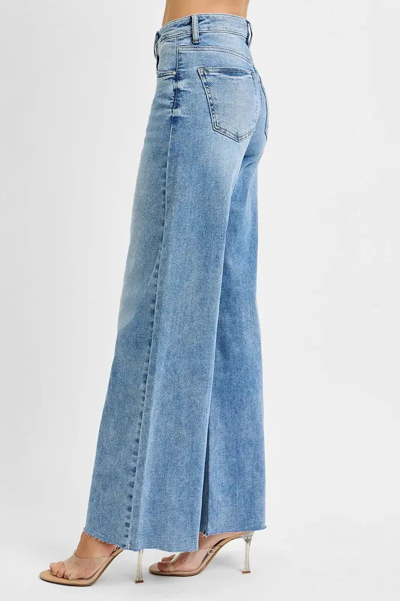 A side view of light blue wide-leg jeans on a white background