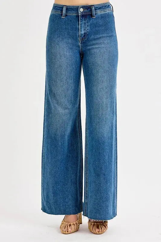 Blue jeans with wide legs on a white background