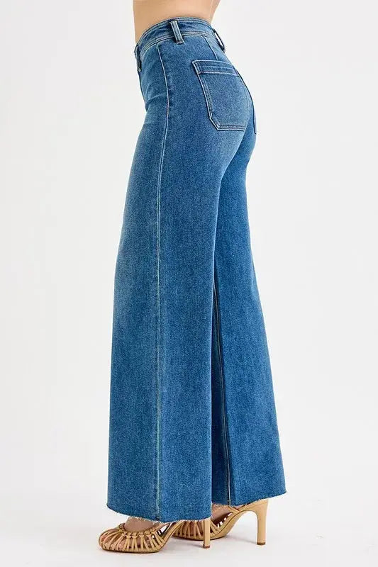 The side view of denim wide-leg jeans on a white background