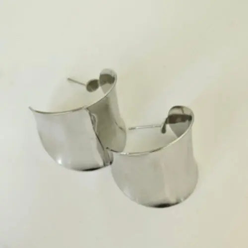 Sleek, simple, and endlessly versatile, these Minimalist Silver Hoops are the ultimate everyday accessory. Crafted with a high-polish finish, they reflect light beautifully and add a subtle shine to any look. Their clean, modern silhouette makes them perfect for both casual wear and more elevated ensembles, offering a timeless appeal that never goes out of style.