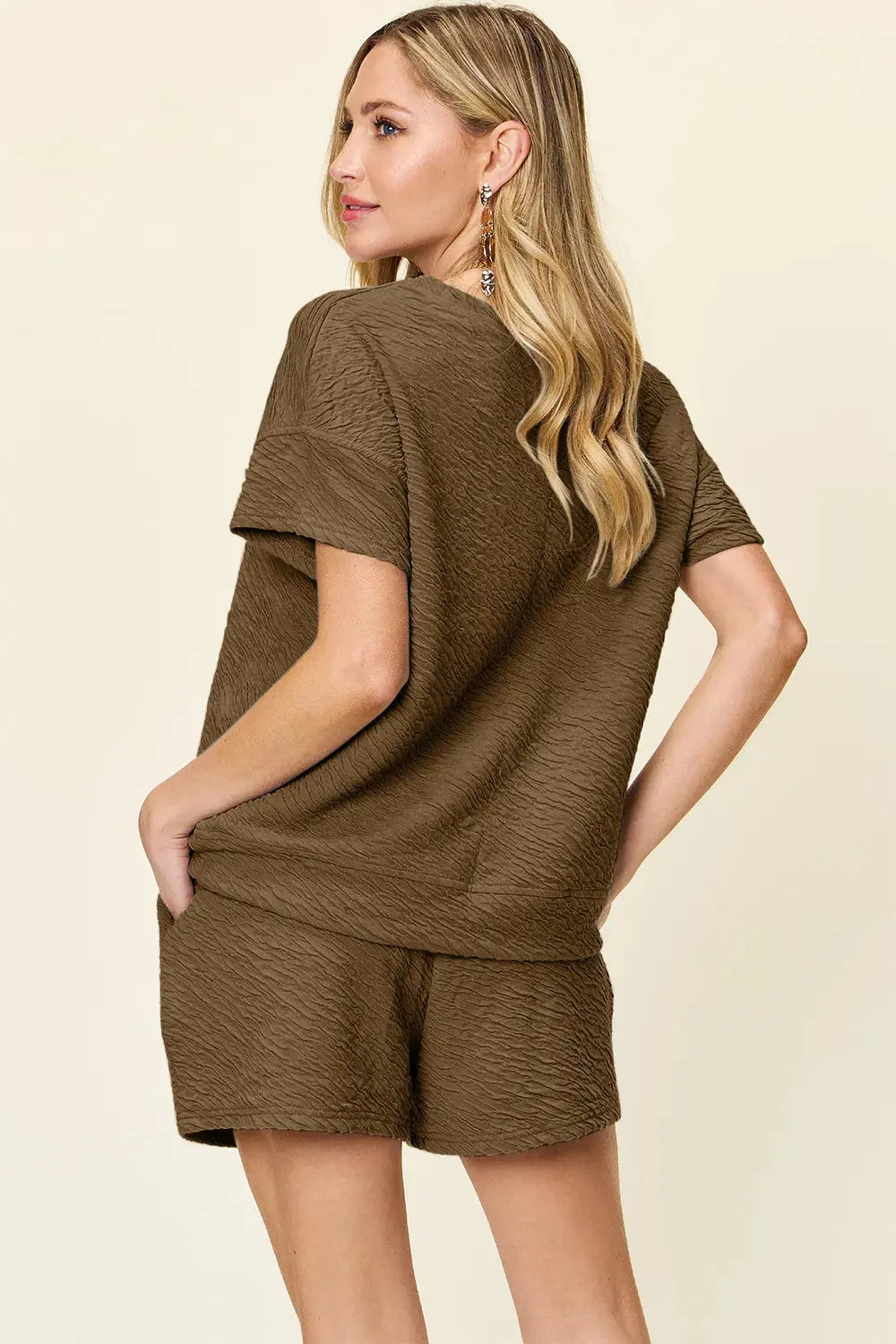 This full-size set from Double Take delivers effortless style with a tactile twist. The short sleeve T-shirt features a relaxed fit and subtle allover texture, offering a modern update to a classic silhouette. Its soft drape and breathable fabric make it ideal for warm-weather wear or layering on cooler days.
