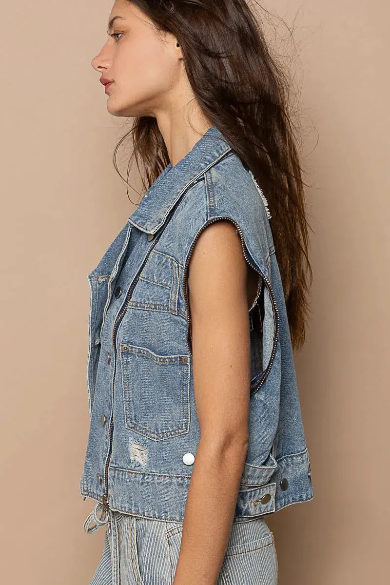 This fashion oversized cropped denim jacket features a vintage-inspired design with premium cotton denim construction. The jacket showcases a relaxed fit with dropped shoulders and a cropped hemline that pairs perfectly with high-waisted bottoms. Multiple zipper accents add edgy detail while the classic blue wash provides versatile styling options. The structured collar and lapels create a sophisticated silhouette, making it ideal for layering over casual outfits or dressing up everyday looks.