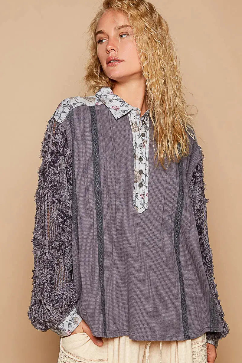 This beautiful blouse features a floral print and delicate lace detailing for a feminine touch. The half-button design adds a stylish and versatile element to the top. With long sleeves, this blouse is perfect for adding a touch of elegance to your outfit while keeping you warm. Elevate your wardrobe with this chic and romantic piece.