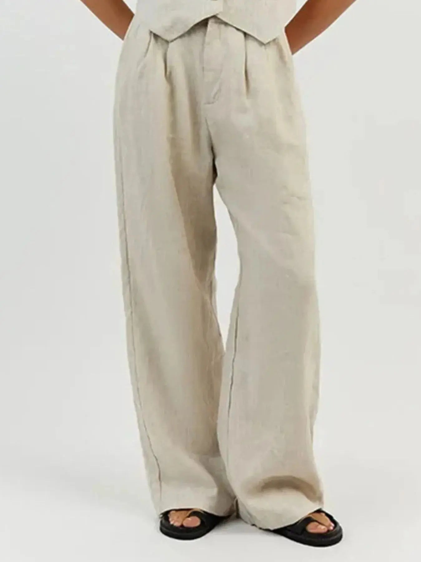 Functional pockets enhance convenience while lending the outfit a utilitarian charm. The top features a modest crop that pairs effortlessly with high-waisted bottoms, while the straight-leg pants offer ease through the hips and thighs. Available in sizes XS to 3XL, the set includes detailed measurements—waist starting at 23.2", bust from 32.3", and full bottom length up to 41.3"—to ensure a personalized fit.