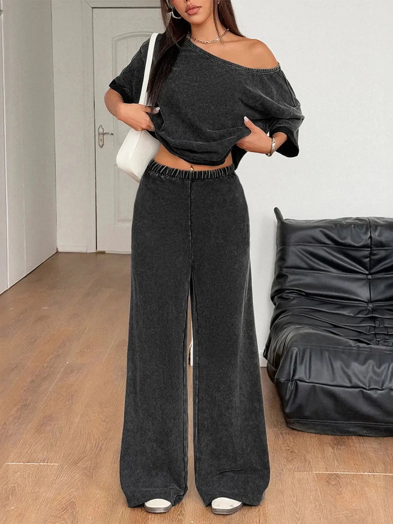 Slip into understated elegance with this boat neck top and wide-leg pants set, designed for comfort without compromising style. The top features a flattering boat neckline that gently frames the collarbone, while the relaxed fit drapes beautifully over the body. It’s a silhouette that feels both timeless and modern, perfect for casual days or elevated lounging.
The wide-leg pants offer a breezy, elongating shape that moves with ease. A high-rise waist and subtle tailoring create a polished look, while the