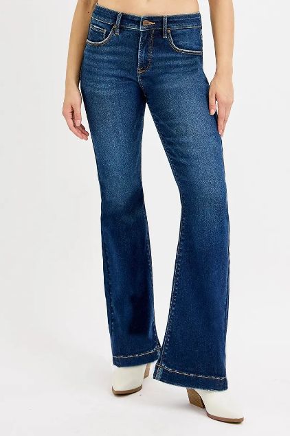 Risen medium wash high rise flare jeans shown from a full-body angle with smooth fading and clean lines.