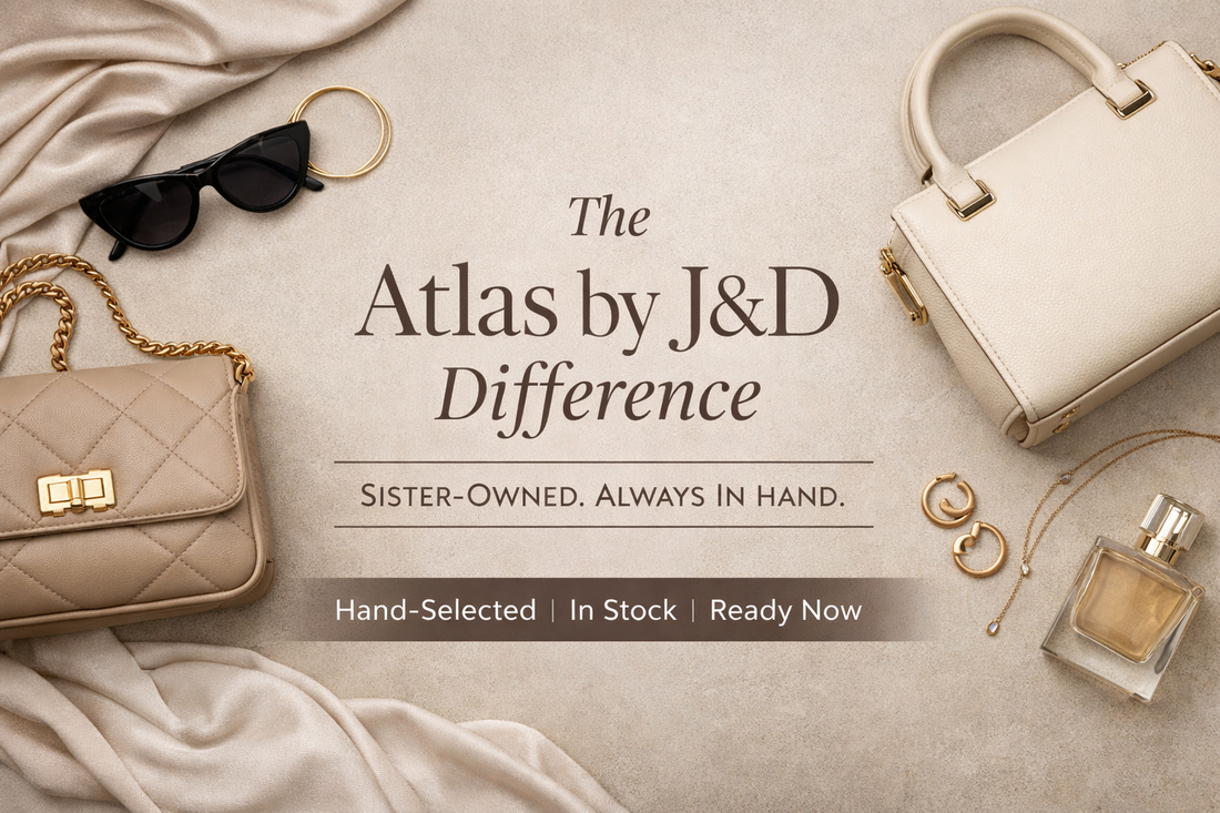 Flat lay of designer-inspired handbags, jewelry, and accessories styled on a neutral background for Atlas by J&D, a sister-owned pop-up boutique with in-stock items.
