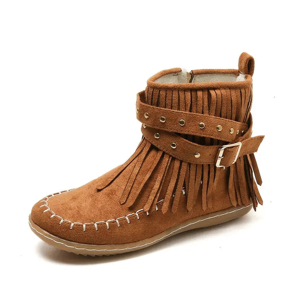Earthy Tones set the tone for effortless style in these studded fringe suede flat boots by Grace Step. Designed to feel like a second skin, the vegan suede contours gently to your foot, creating a balanced mix of grounded elegance and playful charm. Whether dressing up denim or offsetting a neutral maxi dress, this boot adds instant personality to any look.