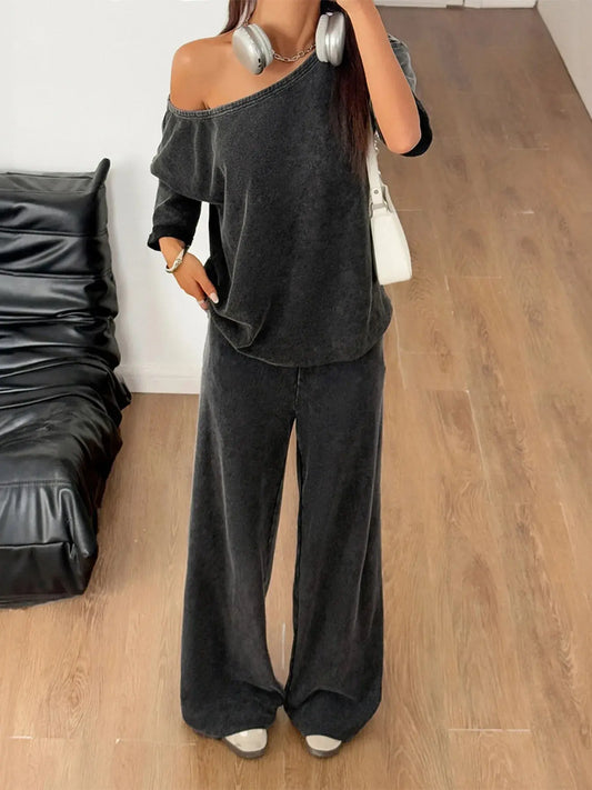 Slip into understated elegance with this boat neck top and wide-leg pants set, designed for comfort without compromising style. The top features a flattering boat neckline that gently frames the collarbone, while the relaxed fit drapes beautifully over the body. It’s a silhouette that feels both timeless and modern, perfect for casual days or elevated lounging.

The wide-leg pants offer a breezy, elongating shape that moves with ease. A high-rise waist and subtle tailoring create a polished look, while the 