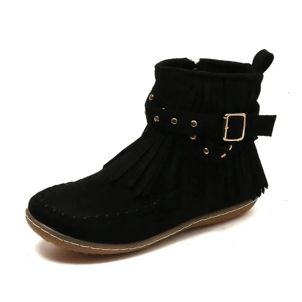 Earthy Tones set the tone for effortless style in these studded fringe suede flat boots by Grace Step. Designed to feel like a second skin, the vegan suede contours gently to your foot, creating a balanced mix of grounded elegance and playful charm. Whether dressing up denim or offsetting a neutral maxi dress, this boot adds instant personality to any look.