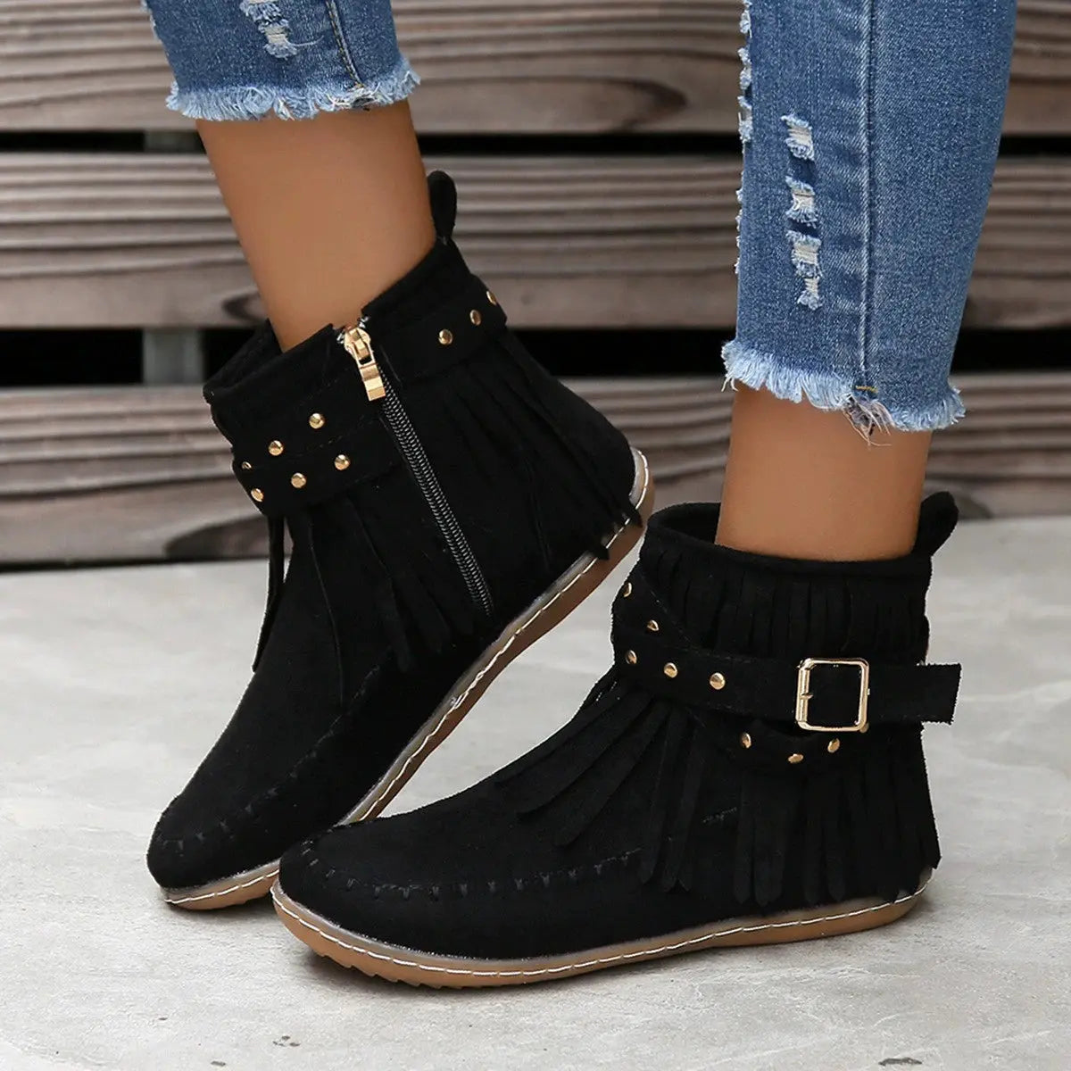 Earthy Tones set the tone for effortless style in these studded fringe suede flat boots by Grace Step. Designed to feel like a second skin, the vegan suede contours gently to your foot, creating a balanced mix of grounded elegance and playful charm. Whether dressing up denim or offsetting a neutral maxi dress, this boot adds instant personality to any look.