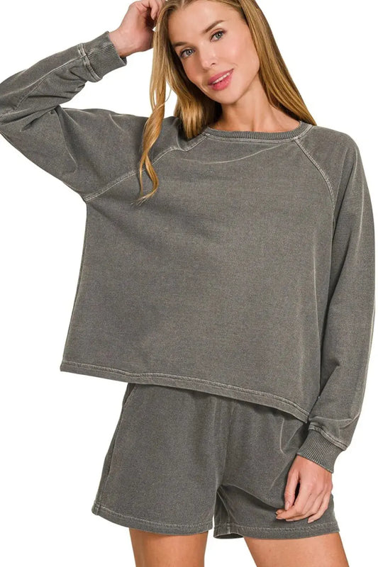 This cozy loungewear set features premium French terry fabric with a vintage washed finish that gives it a perfectly broken-in feel. The relaxed-fit pullover top showcases raw edge detailing and raglan sleeves for effortless style, while the matching shorts offer comfort with an elastic waistband. Made from soft, breathable cotton-blend material, this set is ideal for lounging at home or running casual errands.