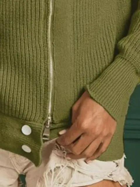 Olive high-neck zip-front sweater styled casually with cream shorts — transitional fall boutique style by Atlas by J&D.