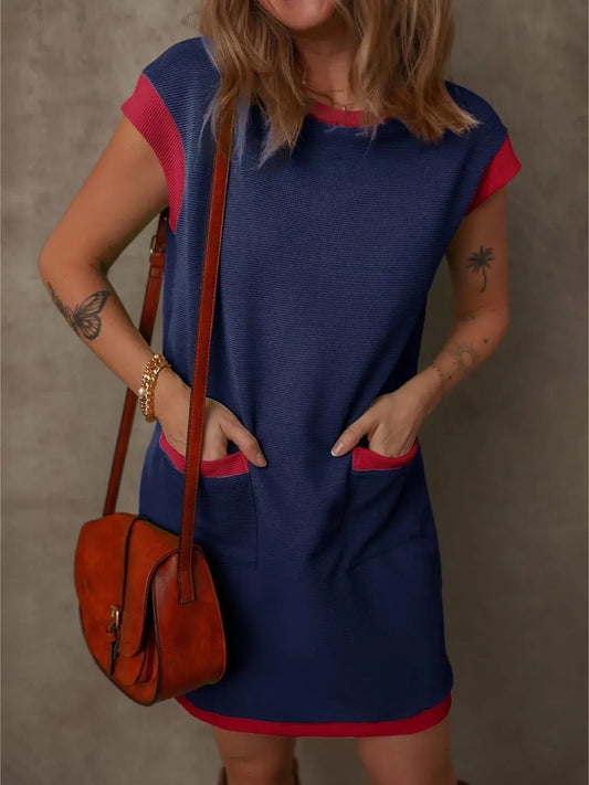 Slip into polished ease with this Round Neck Cap Sleeve Mini Dress—an everyday essential with just the right amount of structure and charm. Designed with a clean button-front and discreet pockets, it balances function with feminine flair. The slightly stretchy fabric ensures comfortable movement, while the unlined finish keeps it light and breathable. Whether you're dressing it up with wedges or pairing it with sneakers for a casual vibe, this mini is your new go-to