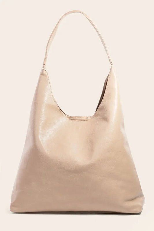 Beige handbag on a light beige background