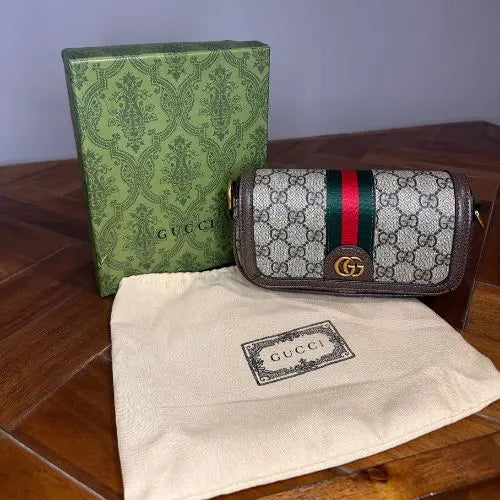 Elevate your accessory collection with this sophisticated designer-inspired crossbody bag. Featuring an elegant monogram print that exudes timeless style, this high-quality bag combines functionality with fashion-forward design. Perfect for everyday wear, it offers convenient hands-free carrying while making a refined statement.