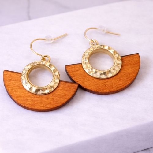 Hammered Gold and Half Moon Amber Wood Dangle Earrings on White Display with neutral background