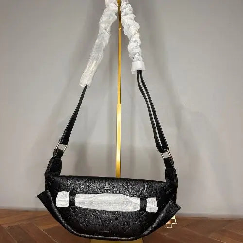 This classic designer-style crossbody bum bag combines timeless elegance with practical functionality. Crafted for those who appreciate refined fashion, it offers a sleek silhouette and adjustable strap for comfortable, hands-free wear. Ideal for carrying essentials securely while maintaining a sophisticated look, this bag is perfect for everyday use or stylish outings.