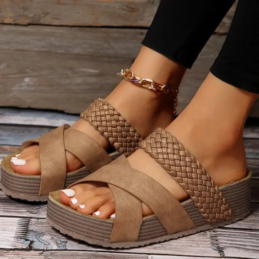 Step into comfort and sophistication with these versatile crisscross sandals, designed to complement your warm-weather wardrobe. Featuring elegantly woven straps, smooth leather finishes, and textured patterns, each pair offers a unique touch while maintaining the signature crisscross design. The cushioned footbed ensures all-day support, while the sturdy sole provides reliable traction for effortless movement.