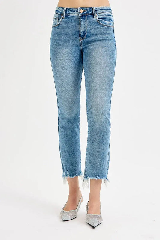 Light blue jeans worn by a person on a white background.