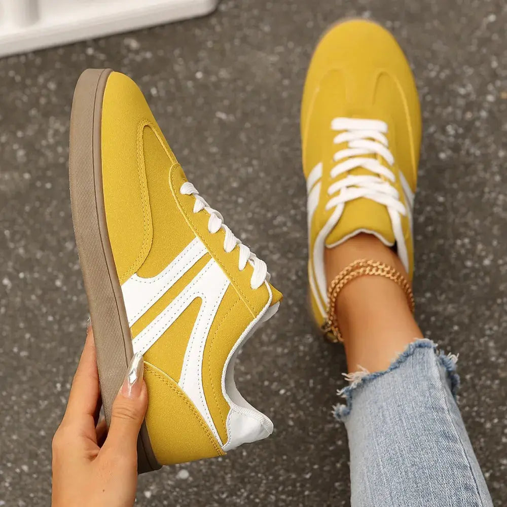 Step into everyday ease with these lace-up round toe flat sneakers, designed for effortless style and all-day comfort. Crafted from durable materials, these sneakers feature a sleek round toe silhouette that offers ample room for a relaxed fit. The lace-up closure ensures a secure, customizable feel, while the flat sole provides stability and flexibility with every step.