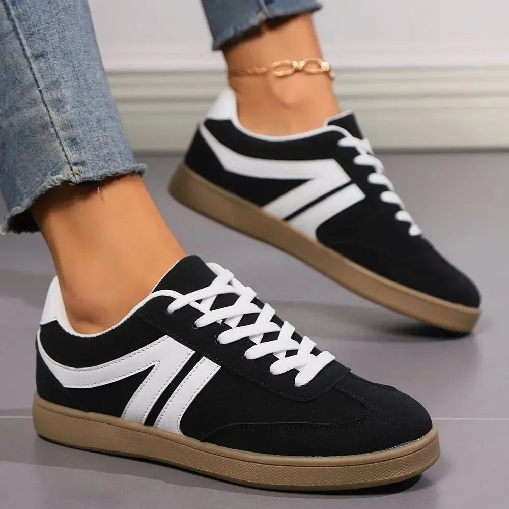 Step into everyday ease with these lace-up round toe flat sneakers, designed for effortless style and all-day comfort. Crafted from durable materials, these sneakers feature a sleek round toe silhouette that offers ample room for a relaxed fit. The lace-up closure ensures a secure, customizable feel, while the flat sole provides stability and flexibility with every step.
