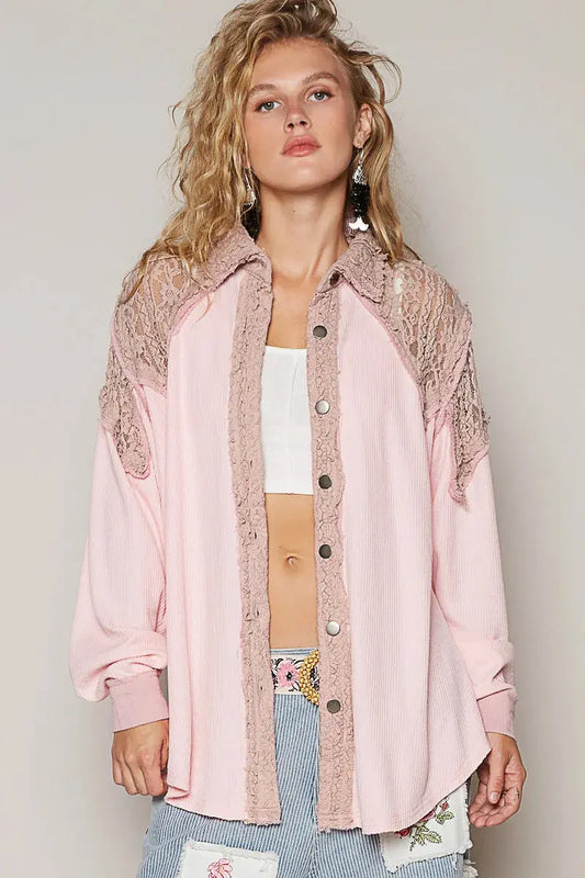 This stunning oversized button-up jacket features a soft pink hue with intricate lace trim detailing along the shoulders and front panels. Made from comfortable cotton blend fabric, this jacket offers a relaxed fit perfect for casual layering. The feminine lace accents add a romantic touch while the oversized silhouette keeps it modern and on-trend. Complete with button-front closure and ribbed cuffs, this versatile piece transitions seamlessly from day to night and pairs beautifully with high-waisted jeans