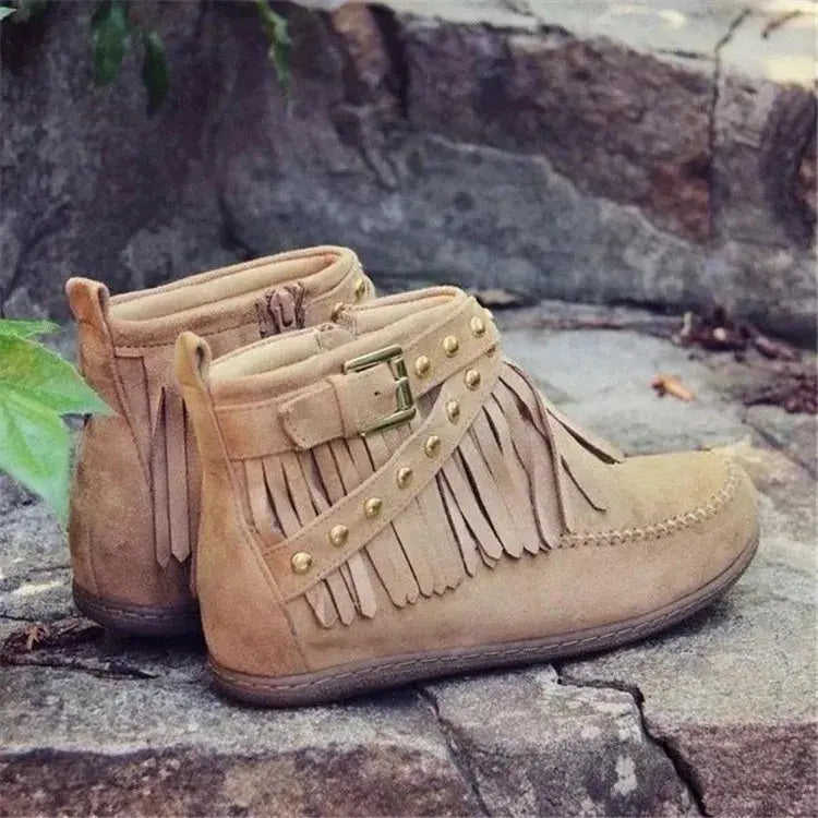 Earthy Tones set the tone for effortless style in these studded fringe suede flat boots by Grace Step. Designed to feel like a second skin, the vegan suede contours gently to your foot, creating a balanced mix of grounded elegance and playful charm. Whether dressing up denim or offsetting a neutral maxi dress, this boot adds instant personality to any look.