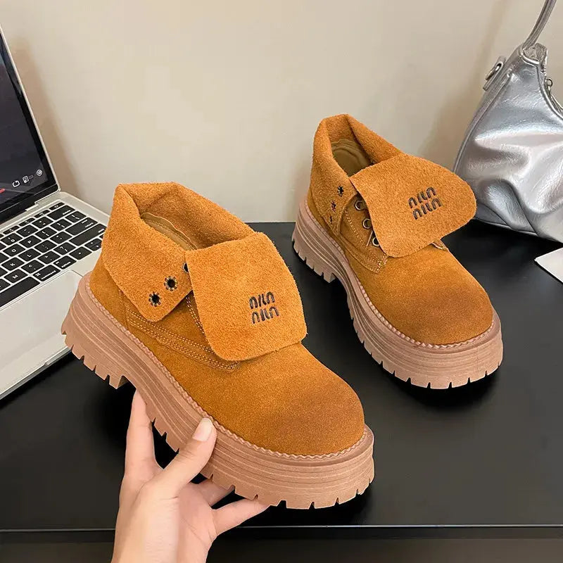 Round Toe meets urban edge in these Crump Street lace-up platform boots, crafted for those who never compromise on comfort or cool. With a mid-heel design and sturdy rubber outsole, you’ll walk confidently through every season. The vegan suede upper offers a luxe touch, making these boots equally suited for casual streetwear or bold layering moments.